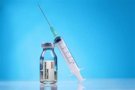The new COVID vaccine is out. Why you might not want to rush .